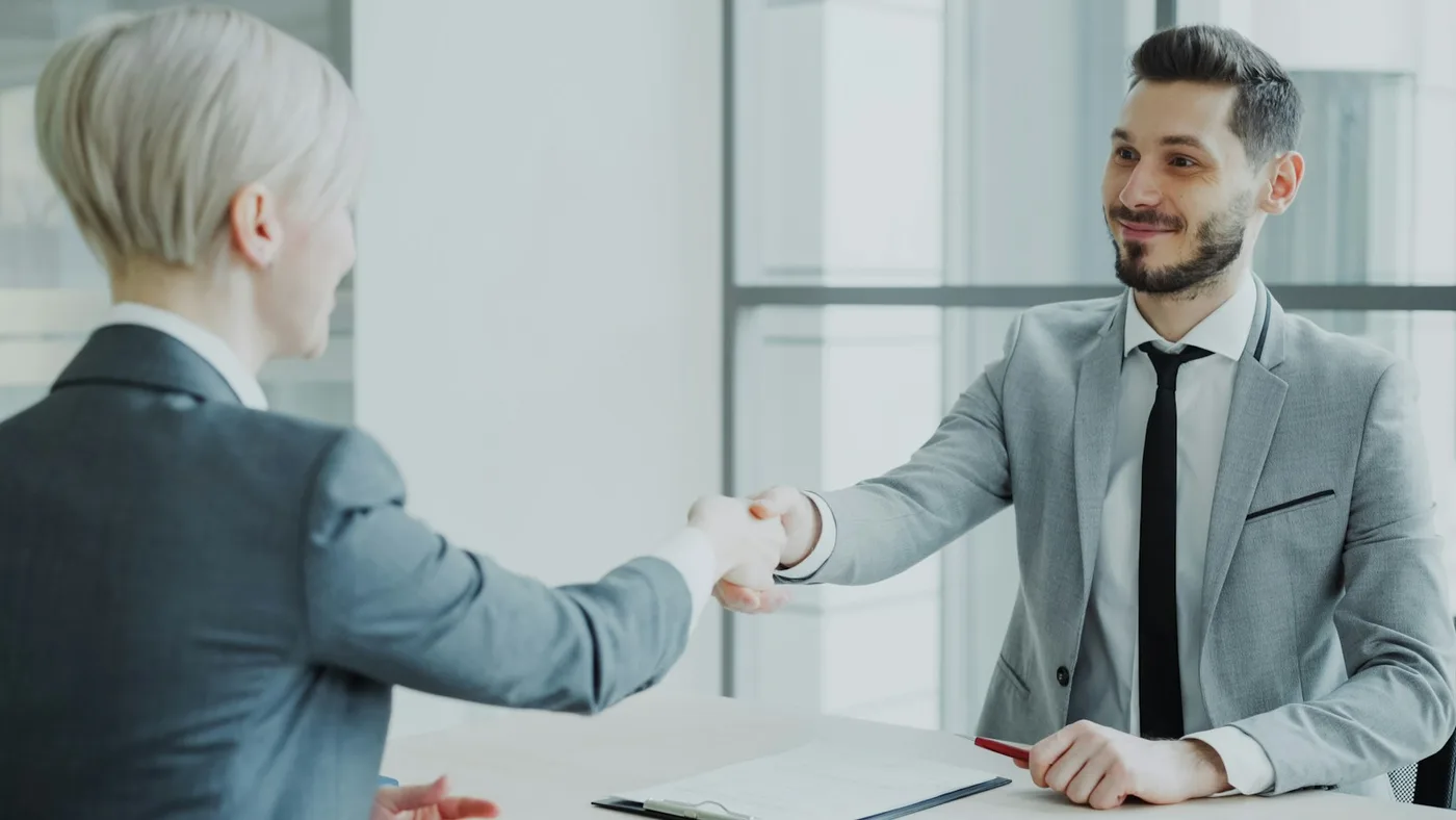 Attorney and client shaking hands after reaching an agreement